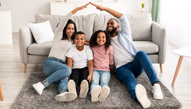 Family sitting in living room