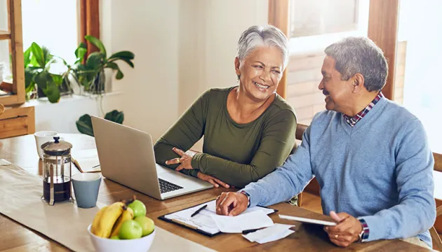 Two seniors on laptop