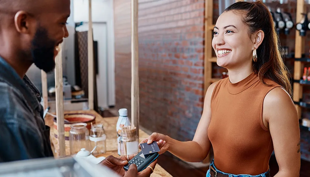 woman paying for food with credit card